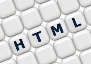 image of white computer keys with letters html, website design development