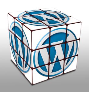 graphic of WordPress W in a cube for WordPress maintenance benefits 